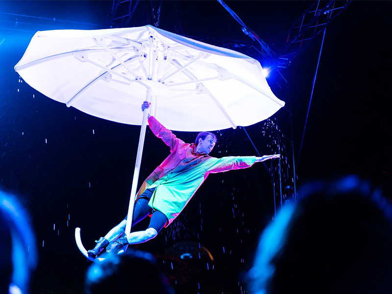 Performer on giant umbrella